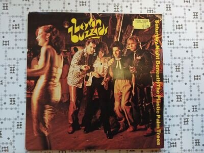 LAYTON BUZZARDS SATURDAY NIGHT BENEATH THE PLASTIC PALM TREES 7 INCH VINYL VGC