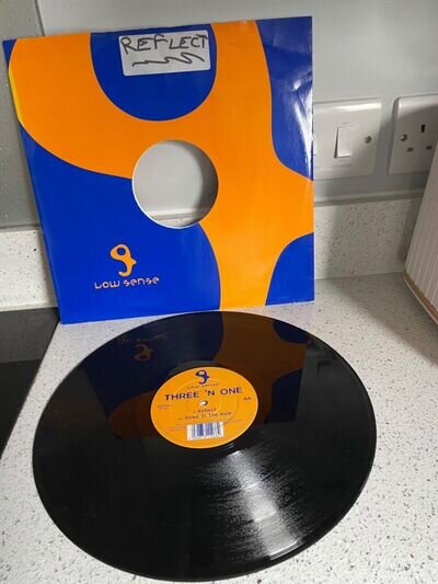 THREE 'N ONE - REFLECT /DOWN IN THE HOLE 12” vinyl nice condition plays lovely
