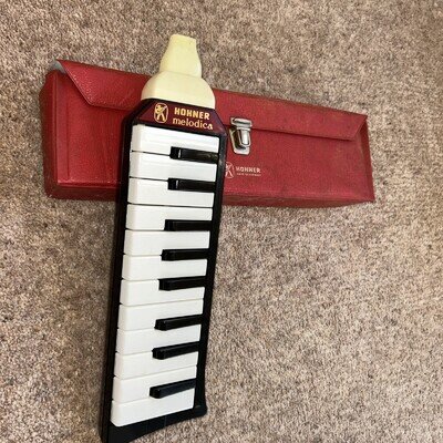 Vintage collectibles Hohner Melodica piano harmonica with original red Case