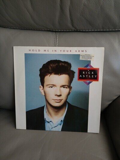 rick astley vinyl lp.hold me in your arms..looks played ..but fair condition.