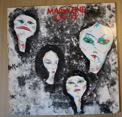 Magazine: real Life. '78 UK Virgin: V2100. Blue labels. 1st Issue A1/B1 MR Blair