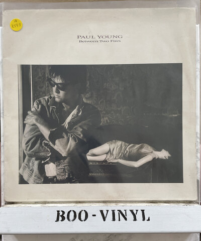 Paul Young - Between Two Fires vinyl Lp Record / album EX / VG+ Condition