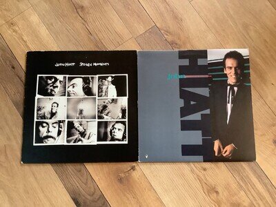 2 X John Hiatt Vinyl Albums. Stolen Moments & Warming Up The Ice Age.