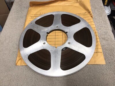 Reel To Reel Metal Tape Spool 10.5 X1/4 Inch With Tape.